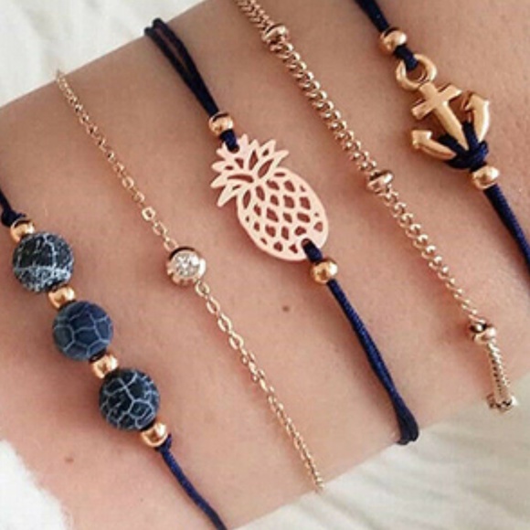 Jewelry - 5 separate pieces -  gold color bracelet set - pineapple, beads, anchor and more